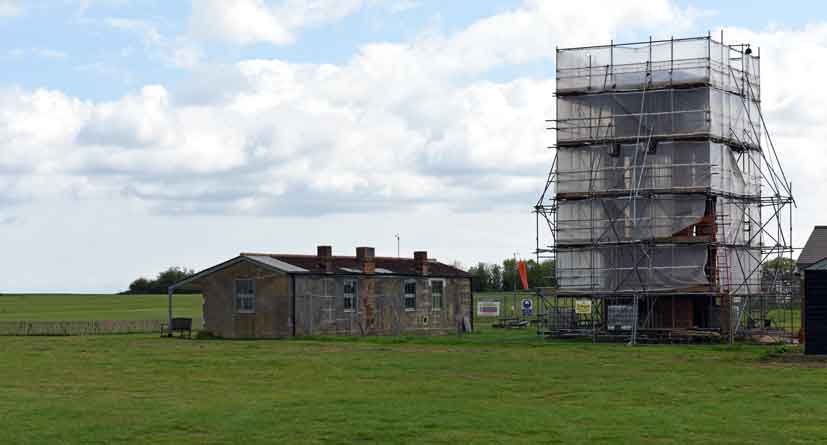 The restored Pilot's Ready Room and water tower receiving attention